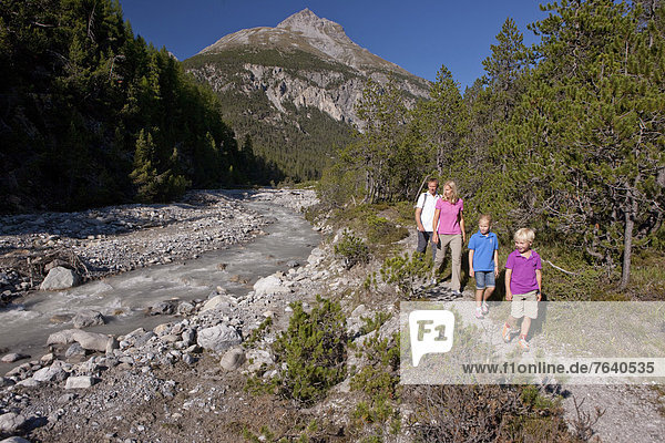 Family  walking  hiking  national park  Ofenpass  nature  Il Fuorn  wood  forest  canton  GR  Graubünden  Grisons  family  footpath  walking  hiking  trekking  Switzerland  Europe  brook