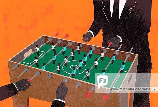 Illustrative image of two businessmen playing foosball