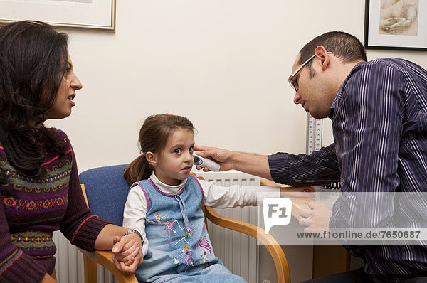 GP doctor's surgery  patient consultation with a girl  United Kingdom  Europe