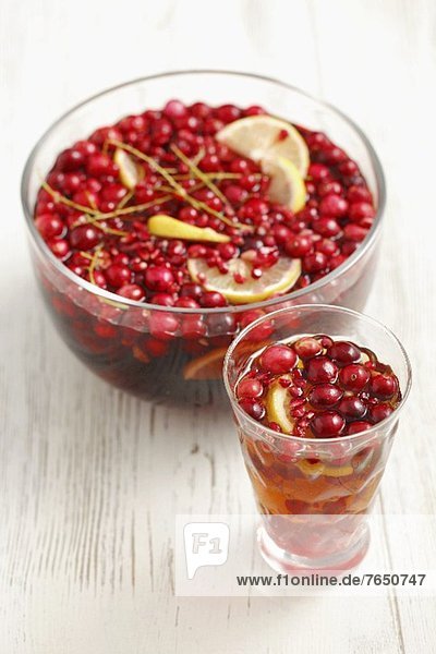 Punch with rum,  beer,  cranberries,  redcurrants and lemon