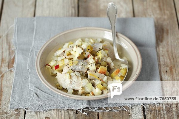Herring salad with gherkins and apple