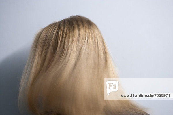 Woman tossing blonde hair