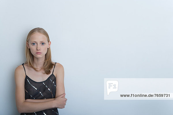 Young woman with arms folded  portrait