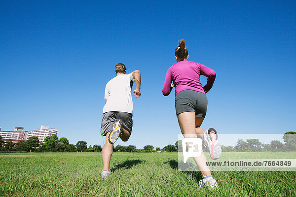Couple running in a park