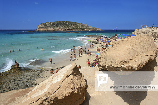 Tourists on the beach  Cala Comte  Platges de Comte  Ibiza  Pitiusic Islands or Pine Islands  Balearic Islands  Spain  Europe