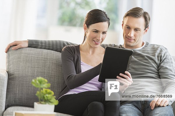 Couple using tablet pc