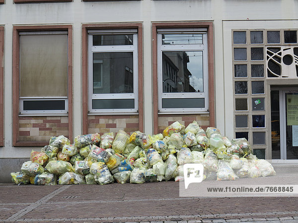 Recycling bags  yellow bags  in front of a house  Freiburg  Baden-Wurttemberg  Germany  Europe