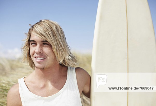 Portrait of male surfer