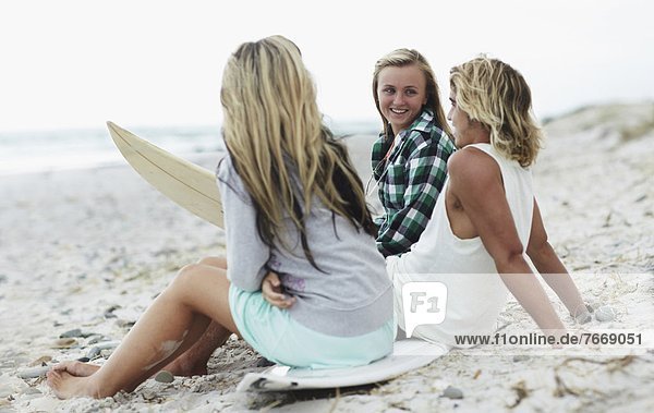 Man and women relaxing on beach