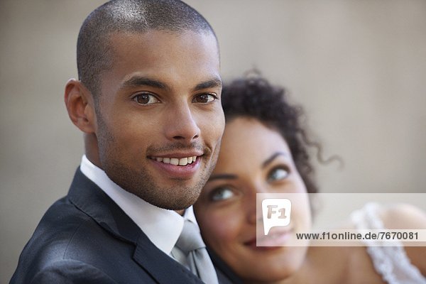 Portrait of newly wed couple  focus on groom