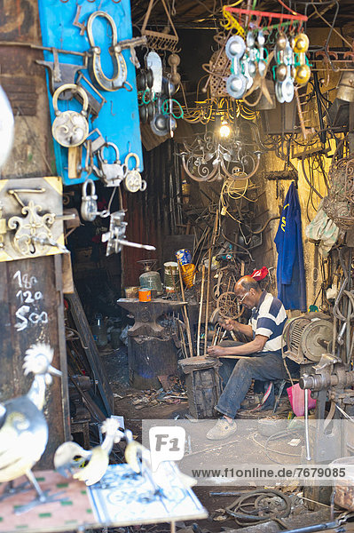 Carpenter and metalworker in his workshop in the souk  Old Medina  Marrakech  Morocco  North Africa  Africa