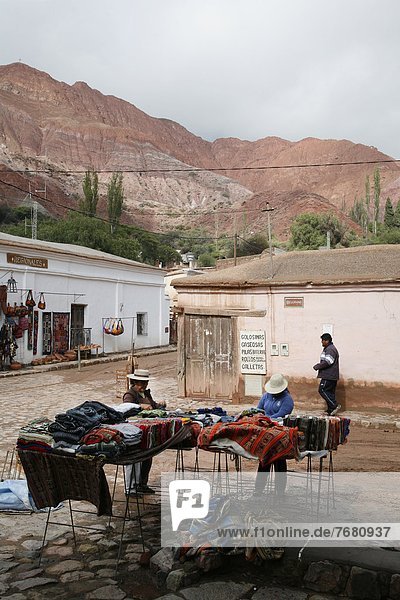 Street scene in Purmamarca with the Mountain of Seven Colors in the background  Purmamarca  Quebrada de Humahuaca  UNESCO World Heritage Site  Jujuy Province  Argentina  South America