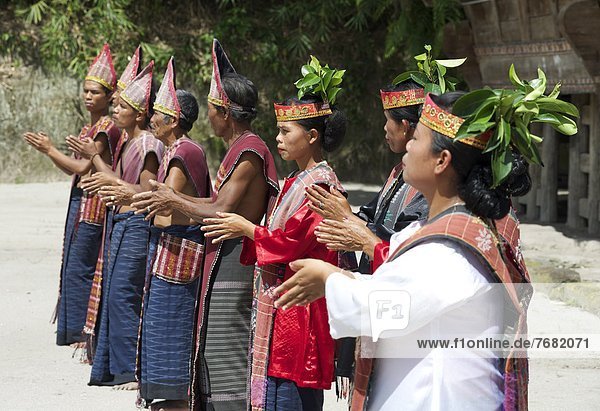 Batak tribespeople in traditional dress performing local dance  Huta Bolon  Simanindo  Sumatra  Indonesia  Southeast Asia  Asia