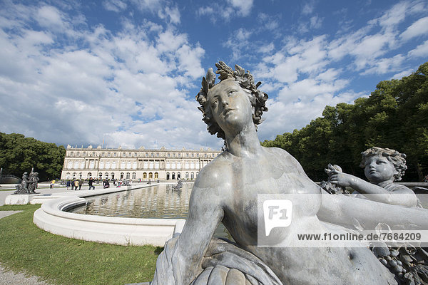 Herrenchiemsee Palace  a female statue from the fountain in the foreground