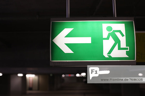 Emergency exit sign in a parking garage