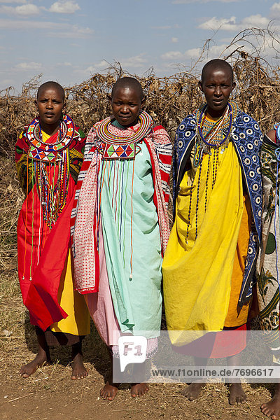 Maasai women wearing traditional dress and traditional jewellery