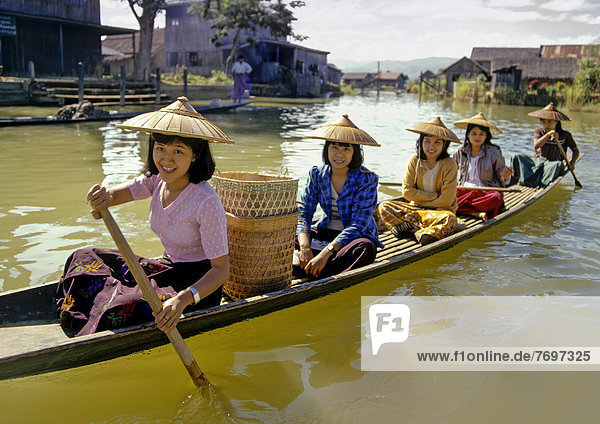 Young women in a boat on Inle Lake