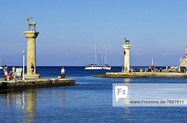 Harbour entrance of Rhodes with Elafos and Elafina  sculptures of a deer buck and a doe on columns  Mandraki harbour