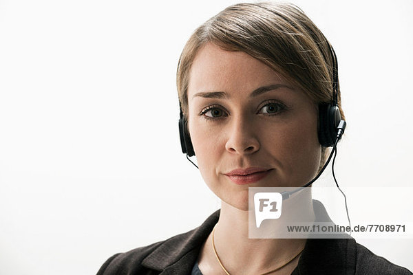 Portrait of businesswoman wearing telephone headset