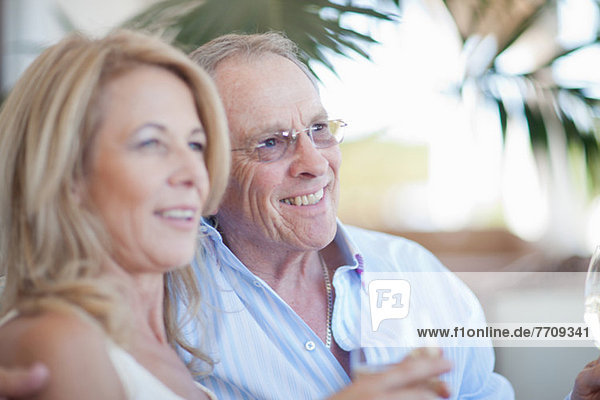 Older couple having wine together