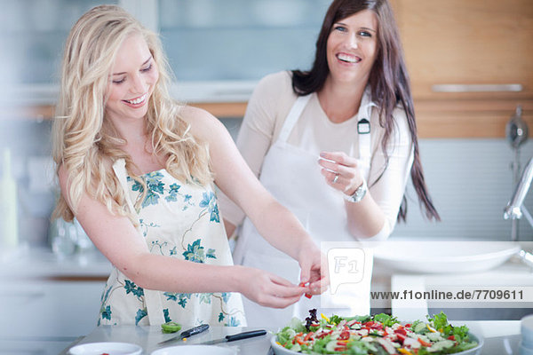 Women cooking together in kitchen