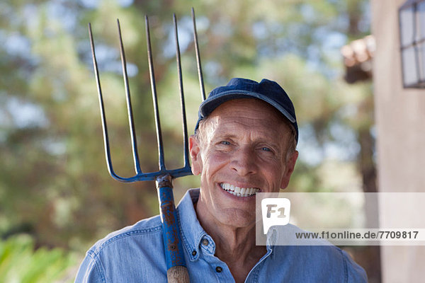 Older man gardening outdoors