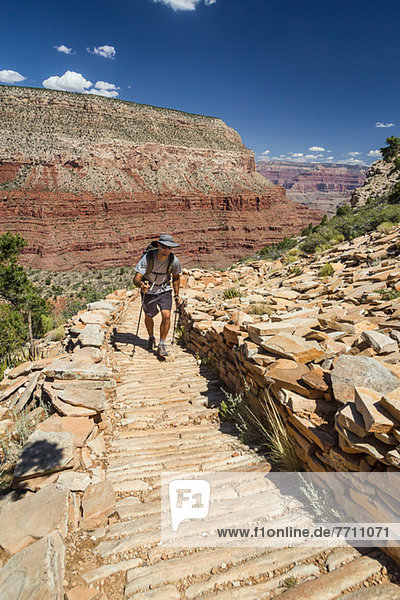 Man hiking trail in Grand Canyon