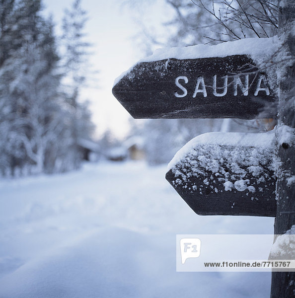 Snow-Covered Sauna Sign
