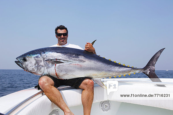 Man holding a bluefin tuna  massachusetts usa