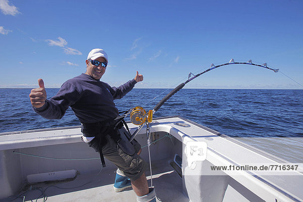 Man on a boat fishing in the atlantic ocean  prince edward island canada