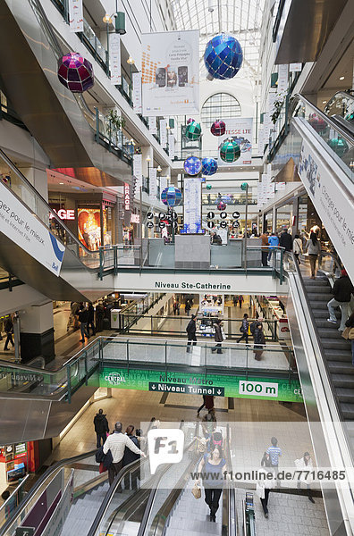 Interior of eaton centre shopping mall and subway escalator Montreal quebec canada
