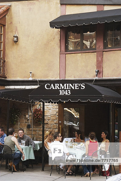 People Dining At Outdoor Tables At Carmines Restaurant On Rush Street  Chicago  Illinois  Usa
