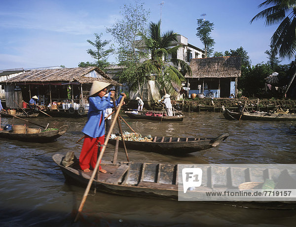 Women Rowing  Mekong Delta