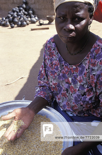 Woman Polishing Rice  Ghana