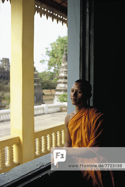 Monk Leaning At Window Frame  Thinking  Angkor Wat  Siem Reap  Cambodia