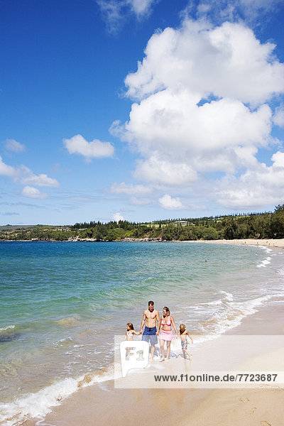 Hawaii  Maui  Kapalua  Fleming Beach  Family On Vacation Walking Down The Beach.