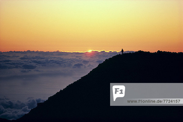 Hawaii  Maui  Haleakala Crater  Person In Distance Watching Sunrise  Above Clouds A46D