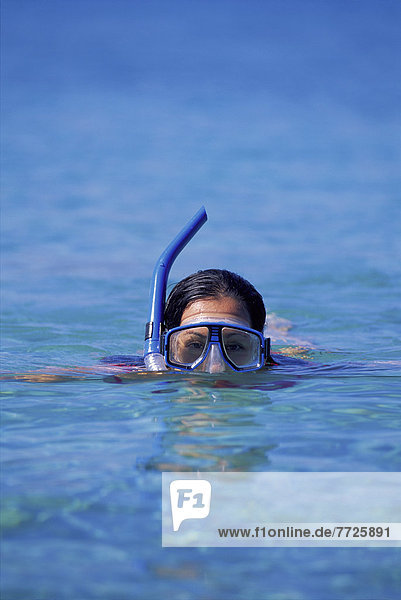 View Upper Part Snorkeler's Face With Mask Peeking Out Of Ocean D1346