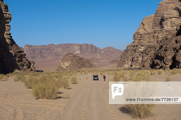 Tourists Travelling By 4X4 Jeep In Wadi Rum  Jordan  Middle East