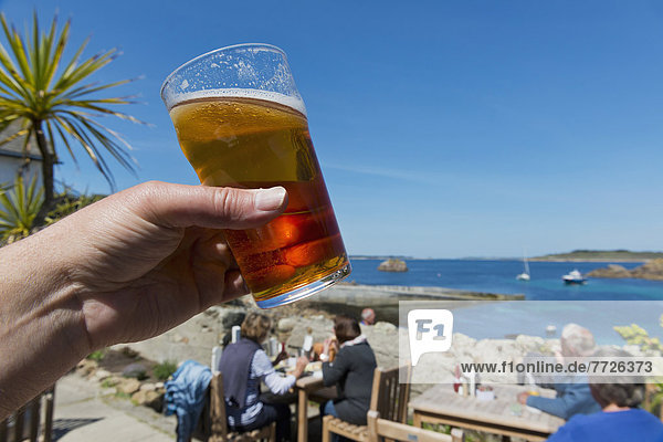 Having A Pint Of Real Ale At The Turks Head Britain's Most South Westerly Pub St Agnes Isles Of Scilly Cornwall Uk Europe
