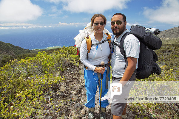 Hawaii  Maui  Haleakala Crater  Two Hikers Stop And Smile While Hiking Kaupo Gap.