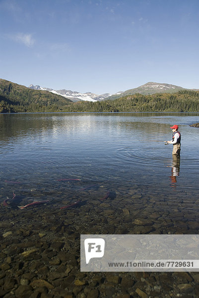 Alaska  Prince William Sound  A Boy Fishing For Salmon At Shrode Lake.