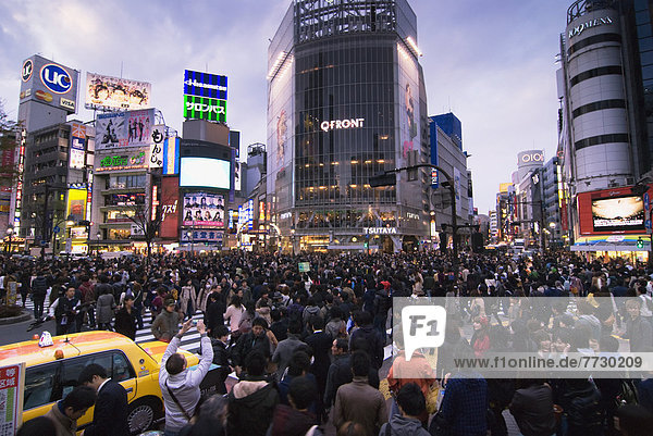 Crowd Crossing An Intersection In Shibuya  Tokyo  Japan
