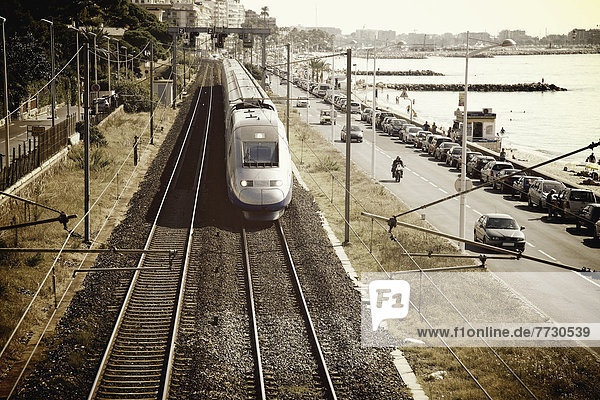 Train And Traffic On The Road Along The Waterfront  Cannes Provence France