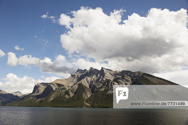 Shoreline Of A Lake Against A Mountain  Banff Alberta Canada
