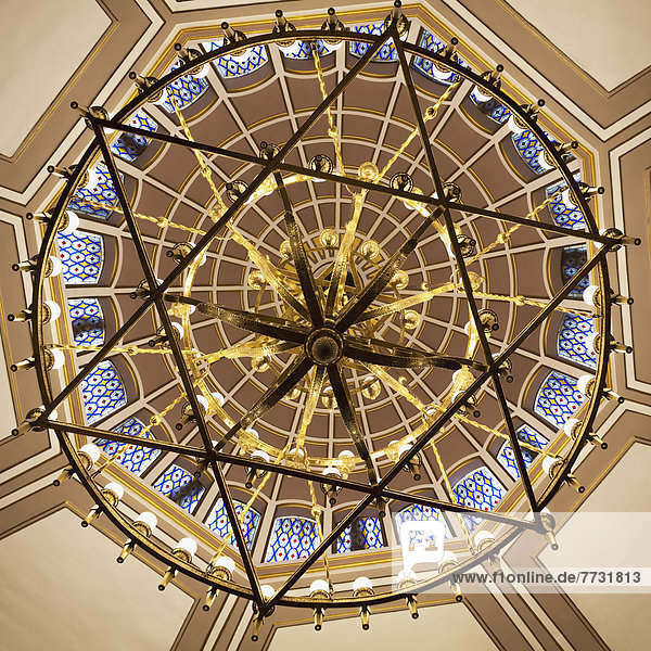 Low Angle View Of A Dome Ceiling Through A Hanging Chandelier In A Star Of David Shape In The Neve Salom Synagogue  Istanbul Turkey