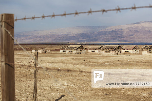 Ruins Of A Jewish Settlement Along The Dead Sea As Seen Through A Barbed Wire Fence  Israel
