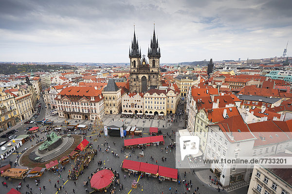 Czech Republic  High angle view of buildings and church with market in town square  Prague