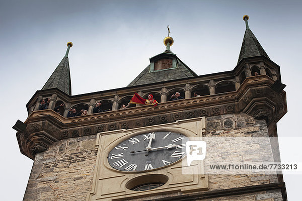 Czech Republic  Low angle view of tourists in clock tower  Prague