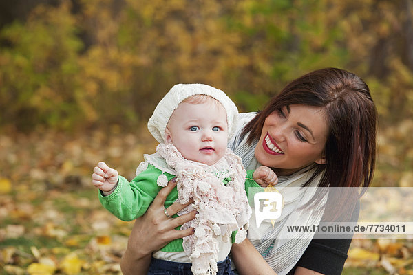 Mother And Baby Girl In The Park In Autumn  Edmonton  Alberta  Canada